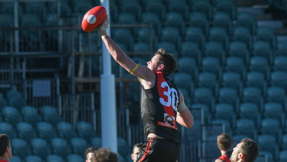 Leaping: Bombers ruckman Alex Lee will suit up for his 100th game for North Launceston this weekend. Picture: Paul Scambler