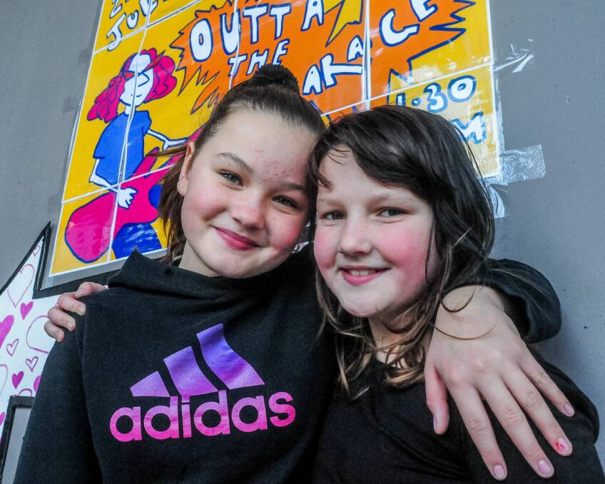 Summer Richardson, 13 and sister Lacey Richardson, 12 at Outta the Garage Concert. Picture: Neil Richardson