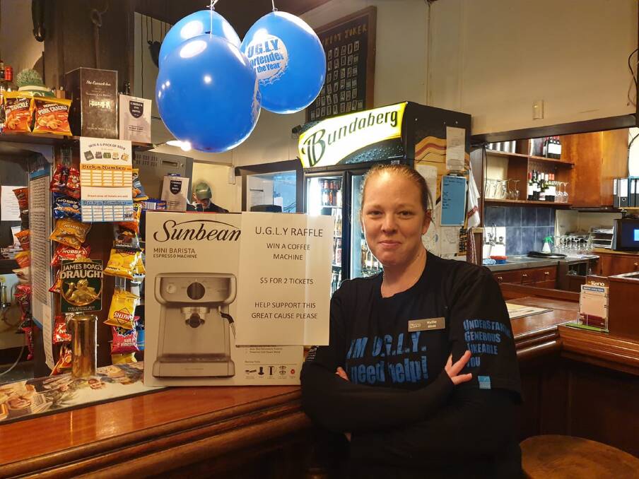 Support from the local: Carrick Inn and Hotel staff member Kellie Duncan with one of the previous raffle prizes. Picture: supplied