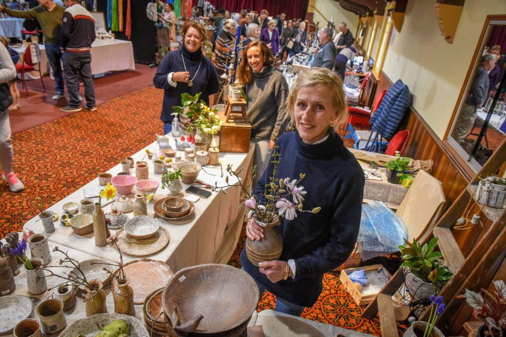 CRAFTY: Jude Mainwaring, of Pipers River, with helpers Sally Sauer and Lucy Glasson at Niche Market at Albert Hall on Saturday. Picture: Paul Scambler 