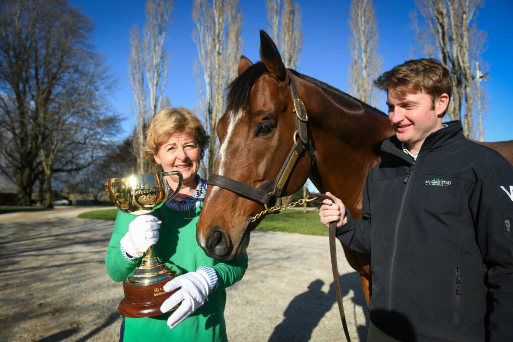 Sniffing success: Robyn Whishaw director of Armidale stud with Needs Further, David Whishaw and the Melbourne Cup, Picture: Paul Scambler.