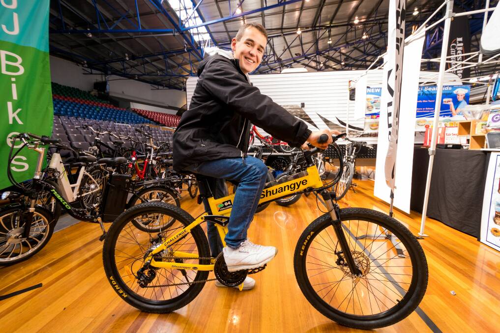 Ride along: Marc Muenger, Swiss exchange student staying at Sheffield, tries out an electirc muntain bike. Picture: Phillip Biggs