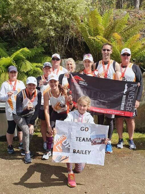 Made it: Scott and Olivia Bailey with 'Team Bailey' after completing the 2019 Point to Pinnacle. Picture: supplied