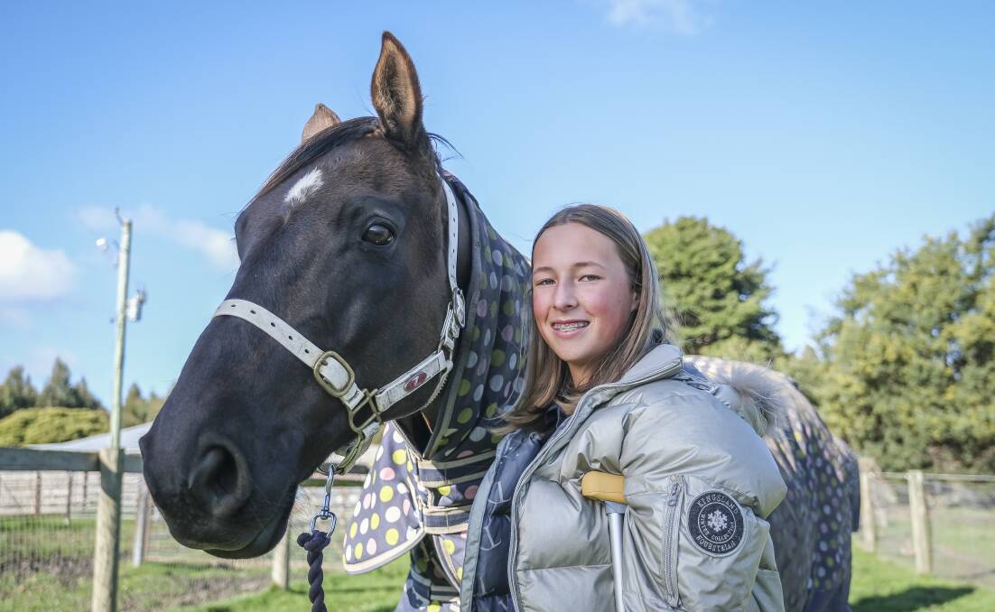 SADDLE UP: Ruby Hirst with horse Tom at the Hirsts' family stud at Westbury. Picture:Craig George