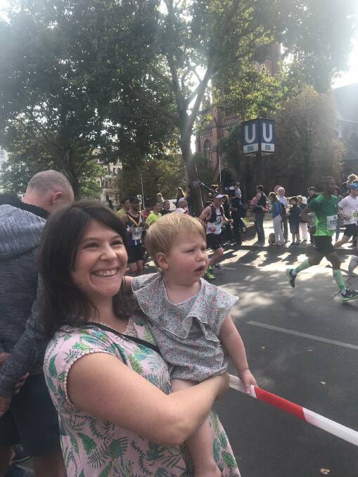 Bottom: Beth and Adele Fenner watching the Berlin Marathon. Adele was in a state of shock when her father Warwick Fenner ran past without a hug.