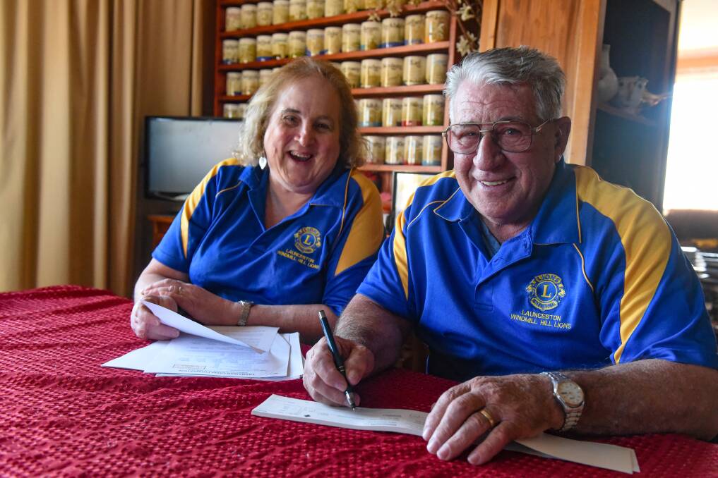 Smiles: Windmill Lions immediate past president Linda Dilworth with club president Derryl Hill writing a cheque for the Winter Relief Appeal. Picture: Paul Scambler 