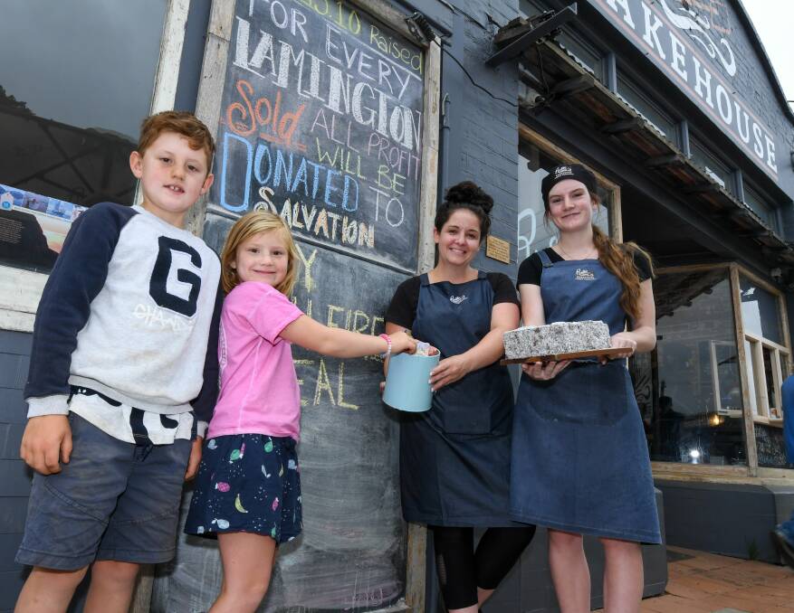 GOOD CAUSE: Edward Green, 8, Camilla Green, 6, of Cressy with owner Katie Lamprey and April Dennis, with the Lamingtons. Picture: Neil Richardson