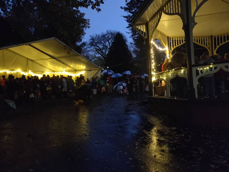 Bright: Crowds braving the rain to take part in the Lantern Walk.