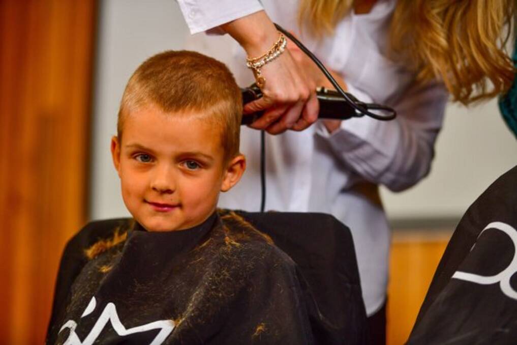 SHAVE: Prep pupil Ethan Fraser gets a trim as Trevallyn Primary hosted their Be Brave and Shave fundraising event. Picture: Scott Gelston