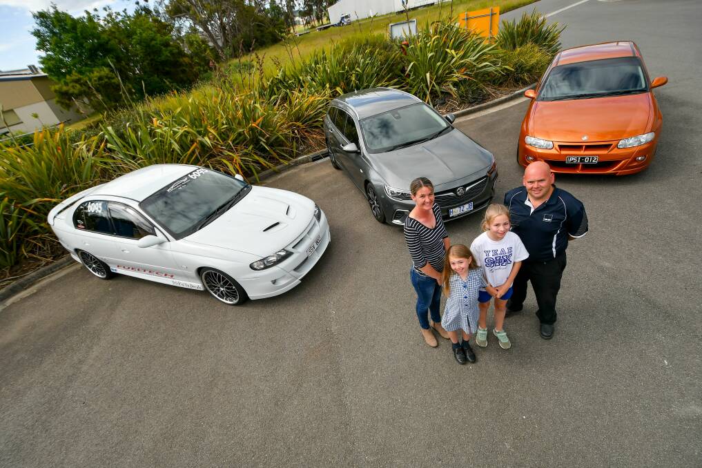 Triple-threat: Michelle, Dakota, 8, Jazmin, 12 and Jason Brown with three of the family's Holden Commodores. Picture: Scott Gelston