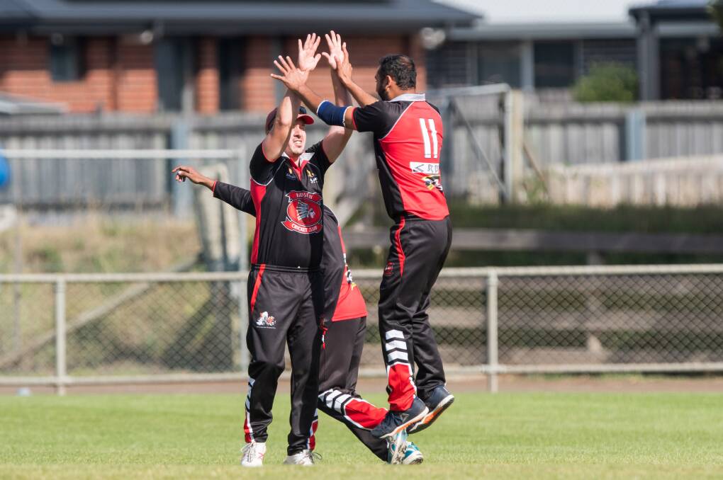 GLORY: Hadspen's Deepak Singh and captain Liam Reynolds celebrate catching out Trevallyn's Jacob Millwood at Longford. Picture: Phillip Biggs