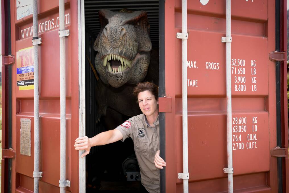Roarsome: Tasmania Zoo manager Rochelle Penney with the zoo's new T-Rex. Pictures: Paul Scambler