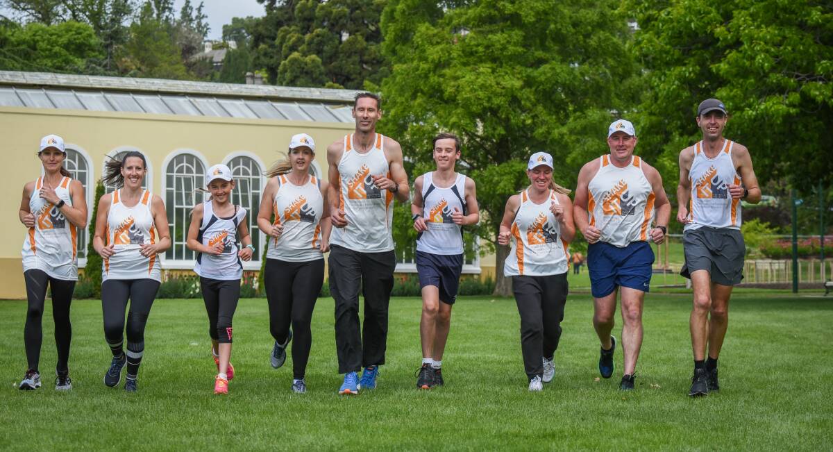 Run: Sophie, Olivia, Scott (middle) and Leo Bailey along with friends getting ready to raise funds for Young Onset Parkinson's Disease. Picture: Paul Scambler