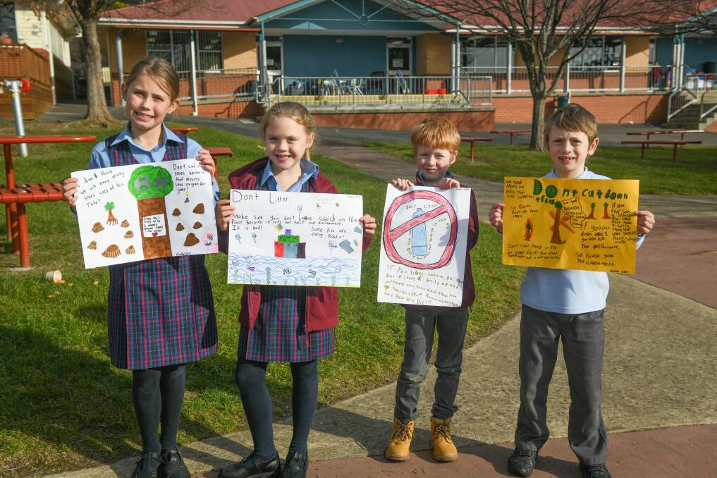 Grade 2 Riverside Primary students, with their posters, Cindy Mundy 8, Grace Howard 7, Cohen Niekamp 8 and Archie Bellinger 7.