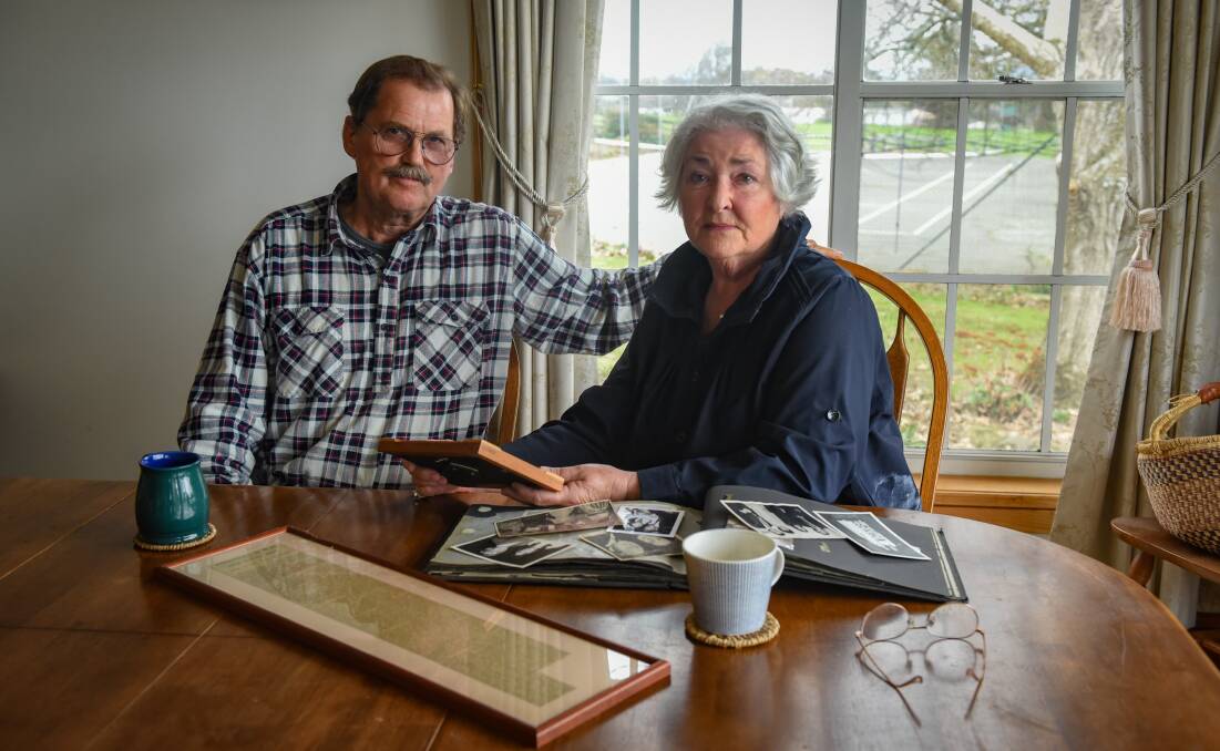 Memories: Henry and Marjorie Burrows of Westbury, look over a family photo album, her father, Roger Dent, worked on the Burma railway. Picture: Paul Scambler