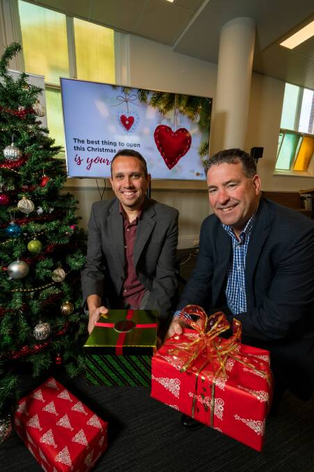 Spirit of giving: City Mission Marketing and Fundraising Manager Rafael Demarchi, and chief executive Stephen Brown. Picture: Phillip Biggs
