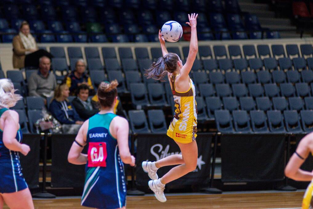 LEAP: Hawks wing defence Lydia Coote generated plenty of turnover for her team in the mid-court against the Blues. Pictures: Phillip Biggs