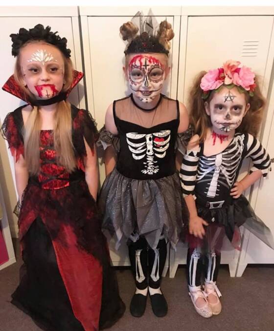 Demonic dancers: Paityn and Willow Tunks with Isabel Walker dressed up for the Spooky Disco. Picture: supplied