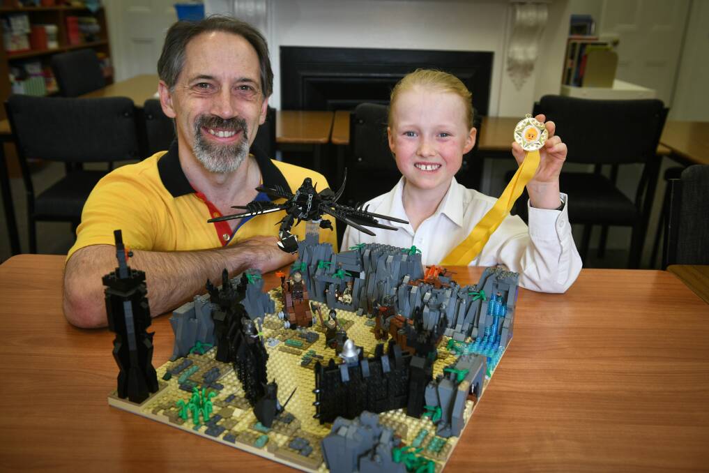 Block by block: Brixhibition's Ken Draeger and 10-year-old Ptolemy Torney showing his Lord of the Rings themed Lego creation. Picture: Paul Scambler