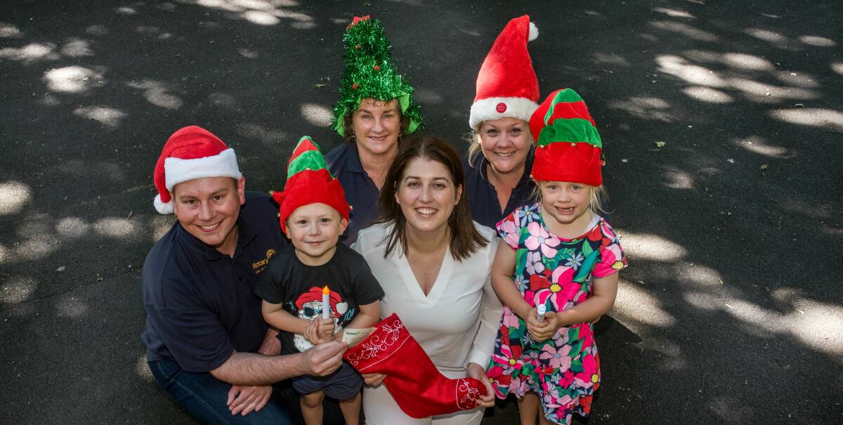 Filling the stocking: Danny Gibson, Declan Gibbons, 5, Judy McLean, Courtney Greisbach, Eve Gibbons and Amy Gibbons, 7. Picture: Neil Richardson