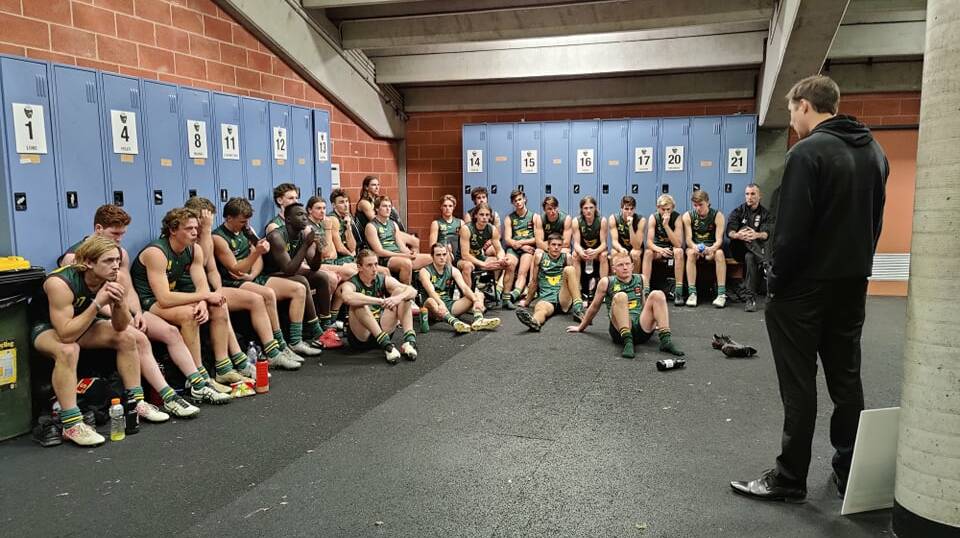 Cameron Joyce debriefs the Devils for the last time after beating Dandenong. Picture: Harry Murtough