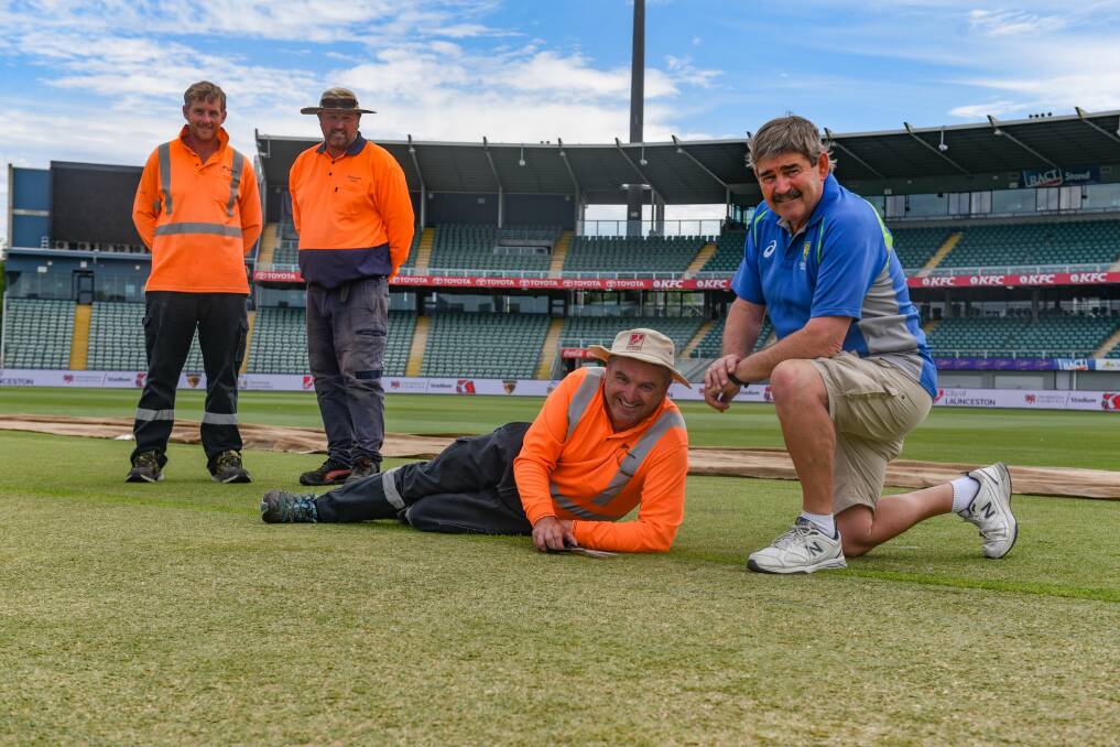 Quick trim: Head groundsman Bryan Dunn gives the final trim with pitch advisor Les Burdett, Grant Wooley and Chris Hay. Picture: Paul Scambler