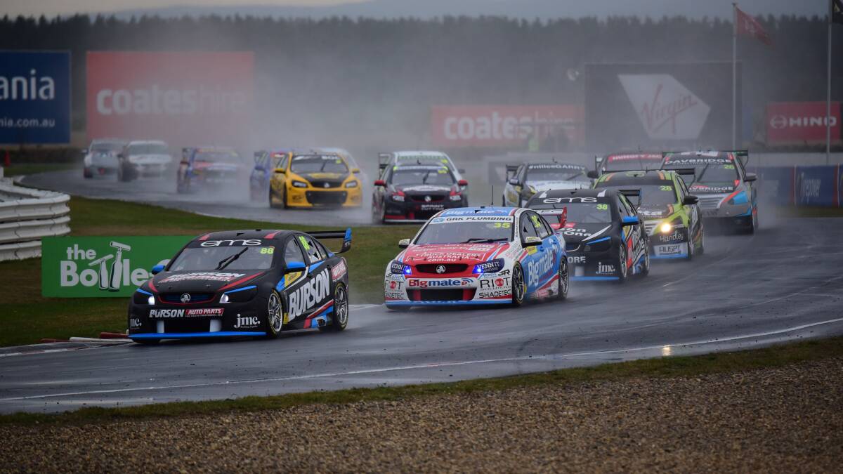 Super2 series leader Paul Dumbrell heads a procession of cars in the wet conditions.