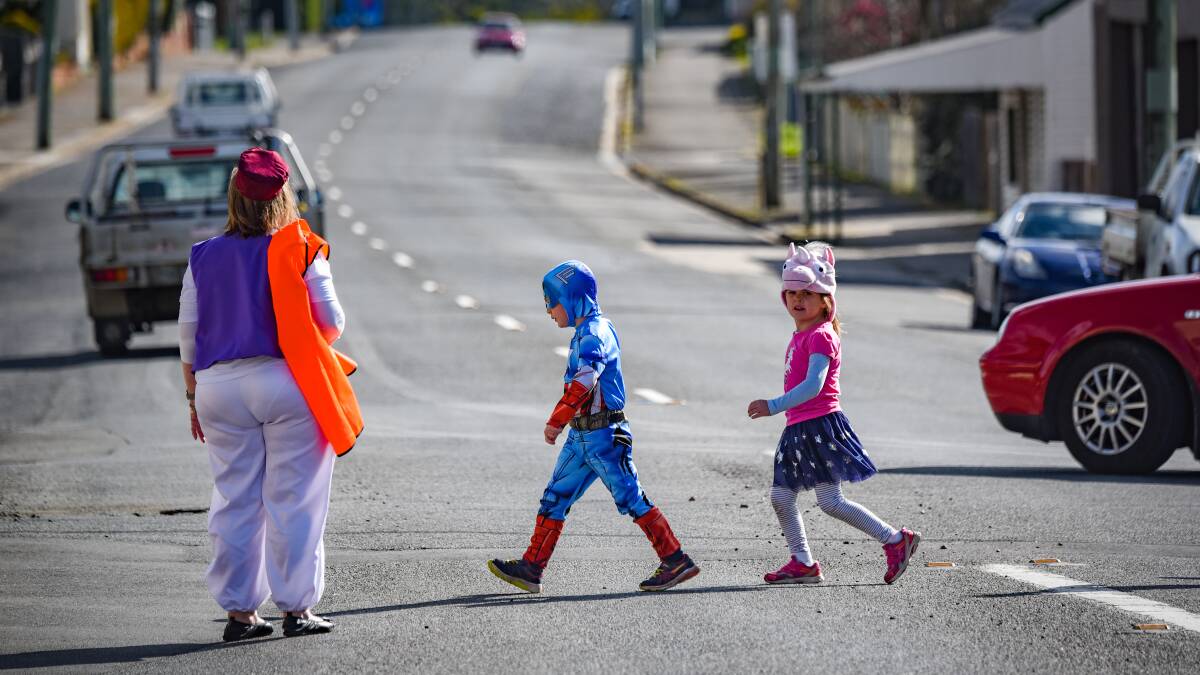 19/08/2019: Blake Slatter as Captain America and Maddison Evans as a unicorn cross the road. 