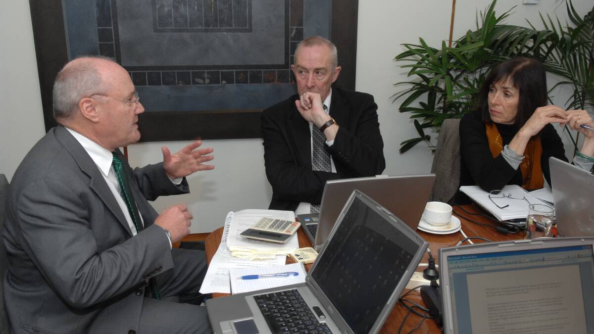 11/06/2009 Treasurer Michael Aird talks with Financial analyst , Tony McCall and Examiner's Alison Andrews