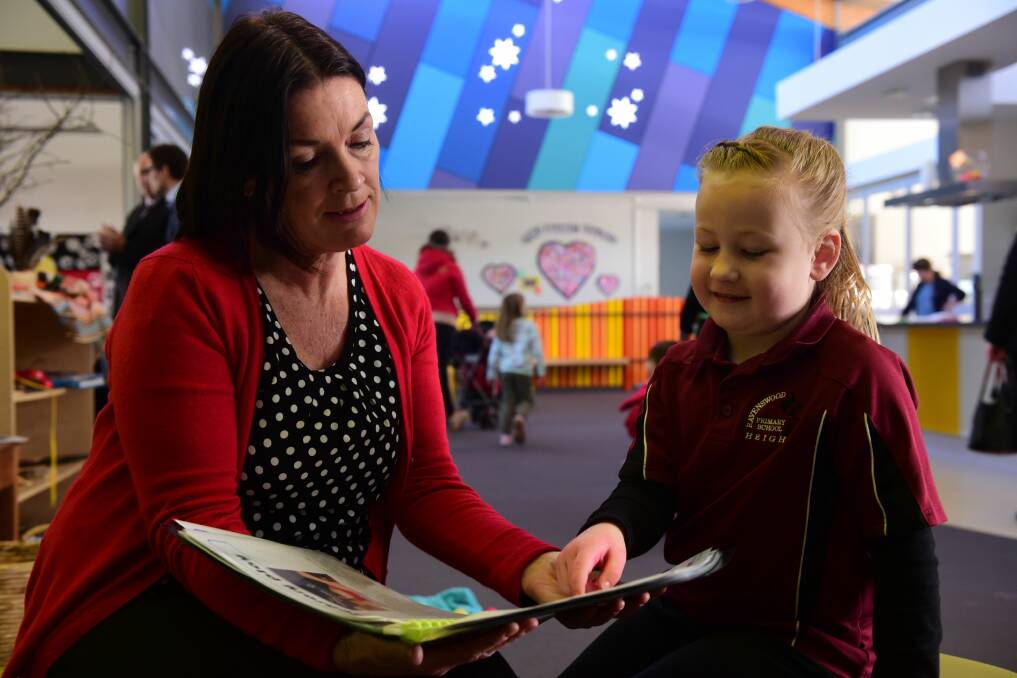 3/07/2015 Registered Nurse Jenna Bayes who is a Primary School Nurse talks with Ravenswood Primary school student Lucy Hawkins at the Ravenswood Community Health Centre. 