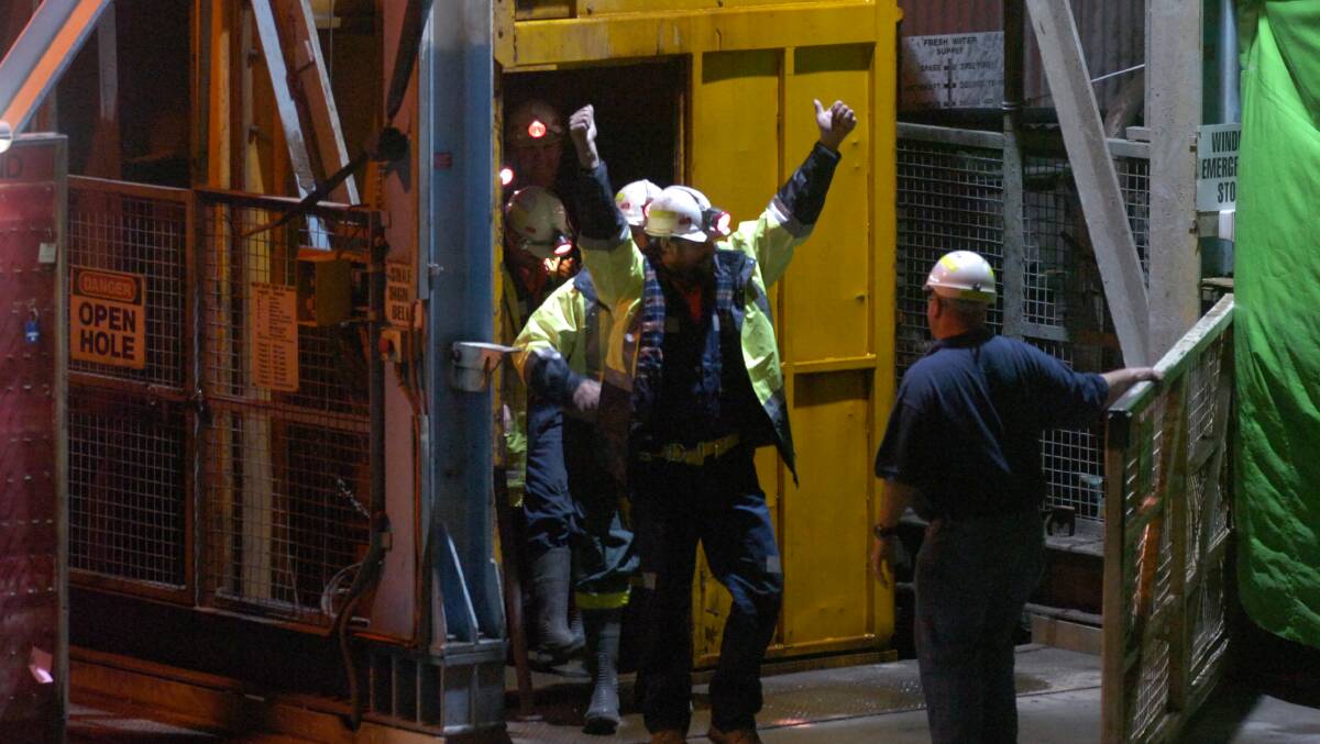 9/05/2006 Miners Todd Russell and Brant Webb walk proudly from the mine shaft after their successful rescue.
