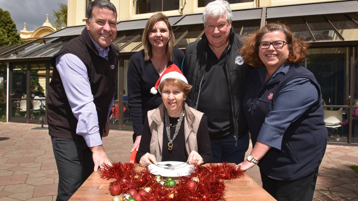 CHRISTMAS: Colony 47's Elizabeth Daly surrounded by City Mission’s Stephen Brown, St Vincent de Paul's Merleen Cronin, Launceston Benevolent Society's John Stuart, and the Salvation Army’s Anita Reeve. Picture: PAUL SCAMBLER.