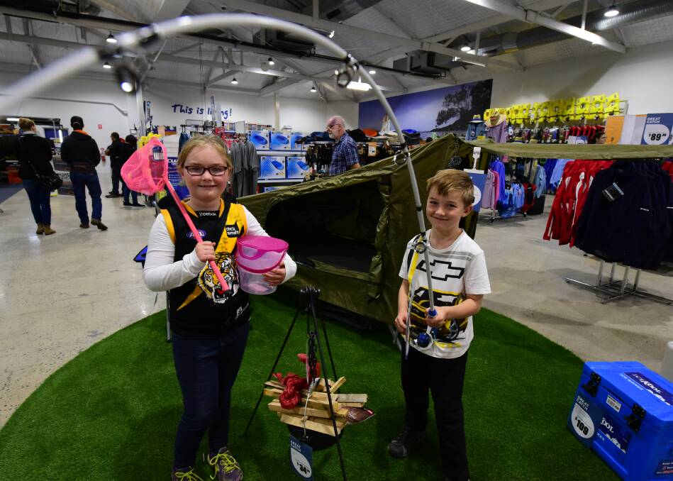 FISHING FUN: Sarah Donovan, 9, and her brother Jack, 7, of Deloraine, check out BCF at its grand opening in Launceston. Picture: Paul Scambler