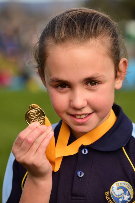 Medal of honour: Charli Davis, of Burnie Primary School, with her medal for winning the girls' 11s race. Pictures: Paul Scambler