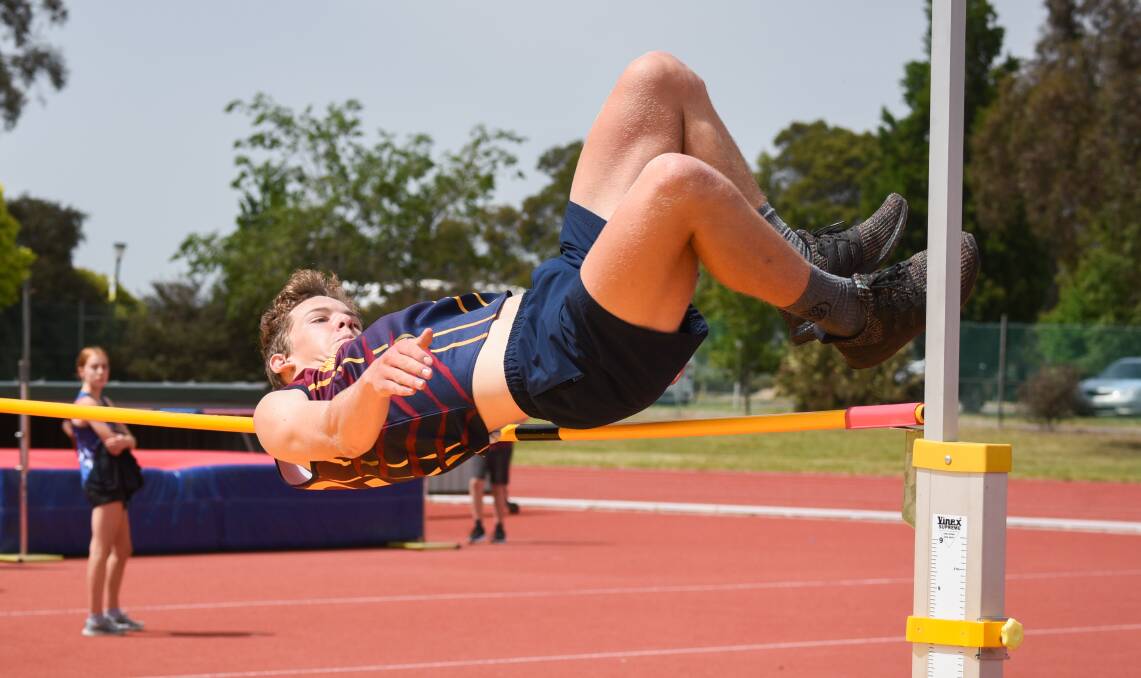 CLOSE: Winnaleah District High School's Liam McKean squeezes over the bar in the grade 8 boys high jump.