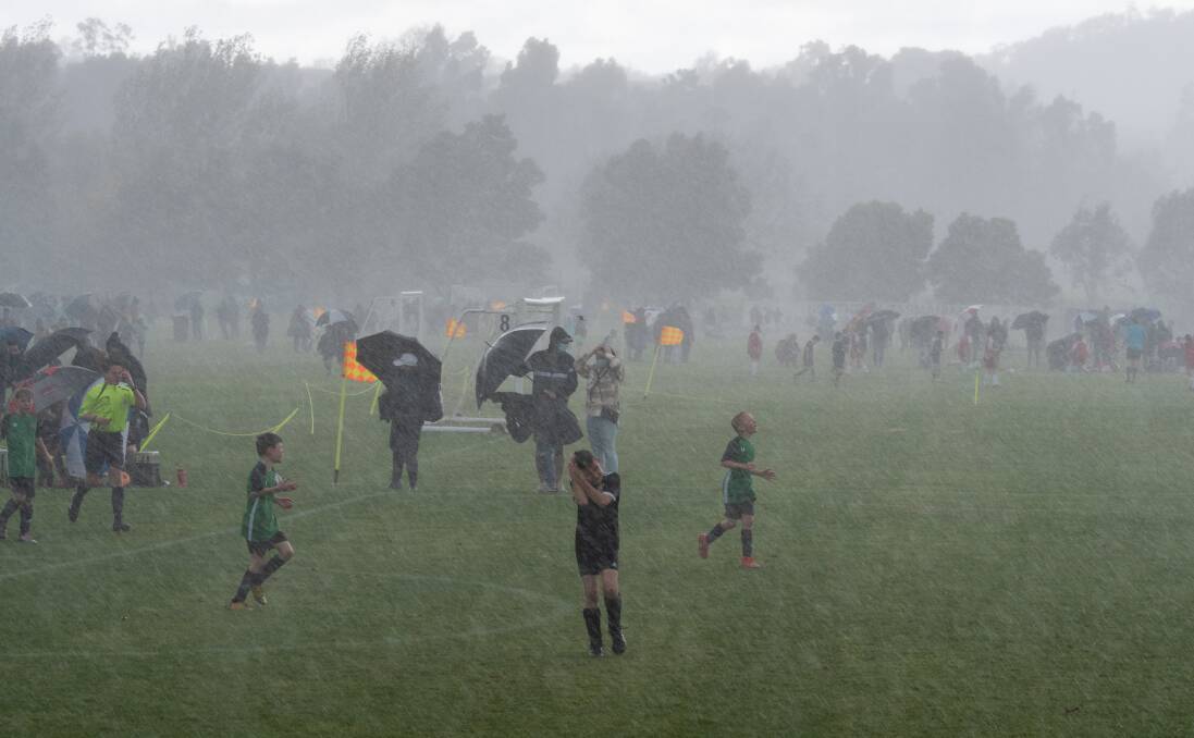 18/9/2021 the rain squall comes through the Launceston Junior Soccer tournament: at Churchill Park