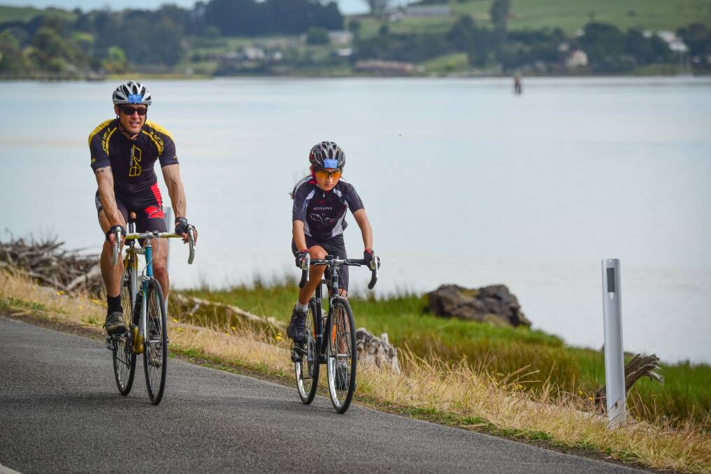TRANQUIL: John Clark and his daughter Abby, both of Devonport, riding along Rosevears Drive. Picture: Paul Scambler