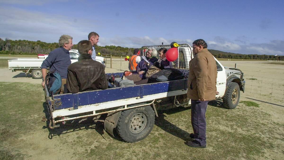 10/05/2005 Alison Andrews with other media, sits in the back of a ute waiting to be transported to the town, on Cape Barren Island for the handback of title to the Tasmanian Aboriginal Community of Cape Barren and Clarke Islands 