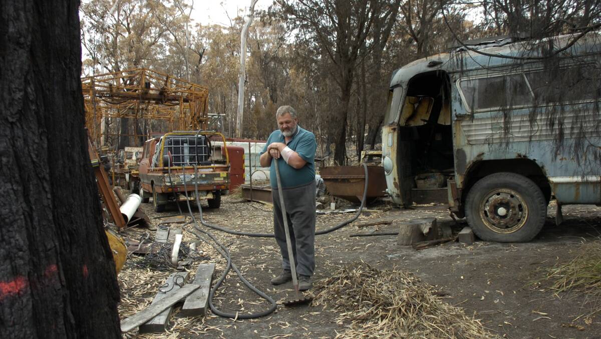 A recovering Mike Webb begins the big clean-up in the area of his Scamander property where he battled a raging bushfire.