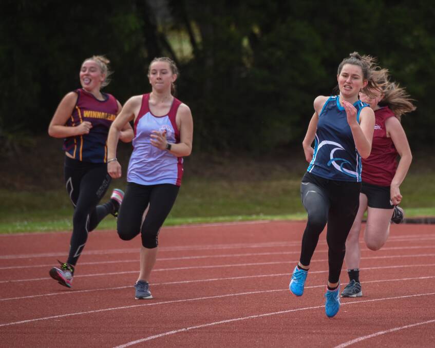 BENDER: St Helens sprinter Zoe Bucknell leads the grade 10 200 metres from rivals Kalina Percey (Winnaleah District), Isabella Brunacci (Star of the Sea) and Tara Guy (St Marys) on Thursday at St Leonards. Pictures: Paul Scambler. 