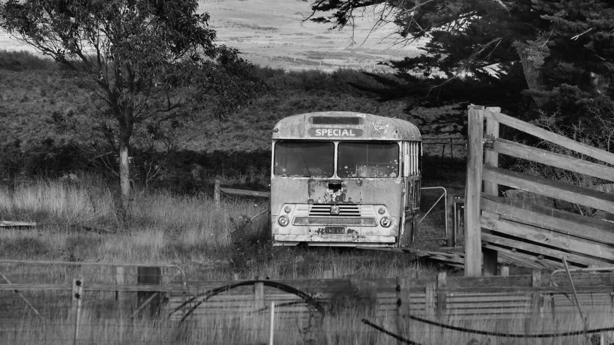A moment in time, an old School bus parked in a farm's paddock along the Coast Road on Flinders Island. 