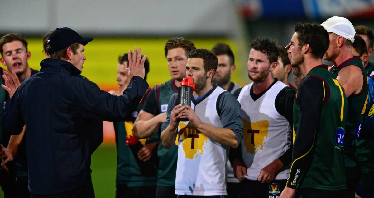 IN CHARGE: Tasmanian coach Brett Geappen talks to his players at training at Aurora Stadium on Wednesday in preparation for their state game against WA. Picture: Phil Biggs