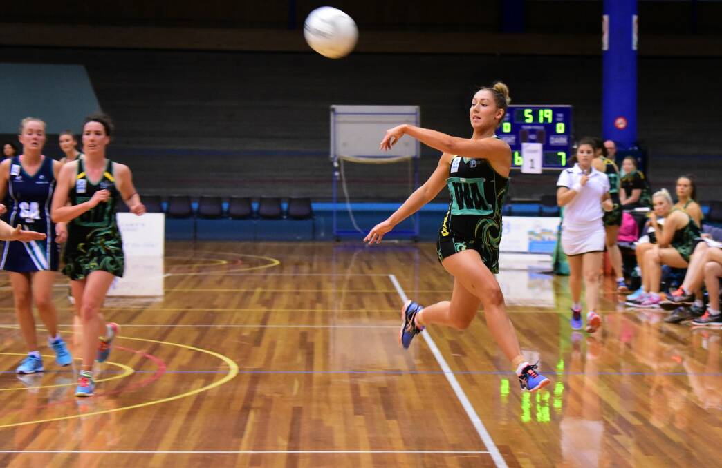 FULL-FLIGHT: Cavaliers wing attack Shelby Miller passes the ball in their State netball game against Kingston at the Silverdome. Picture: Paul Scambler