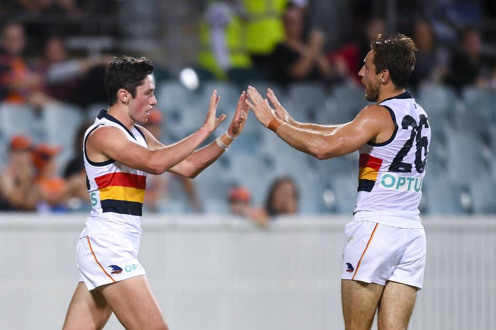 BIG MOMENT: Chayce Jones celebrates a goal with Richard Douglas in the pre-season. Jones will make his AFL debut on Saturday. Picture: AAP Image/Lukas Coch