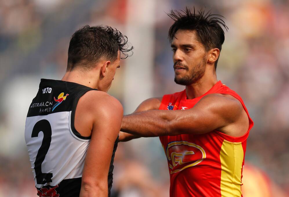 HELLO: Sam Powell-Pepper and Aaron Hall get know each other during Port Adelaide's win over Gold Coast on Sunday. Picture: Getty Images