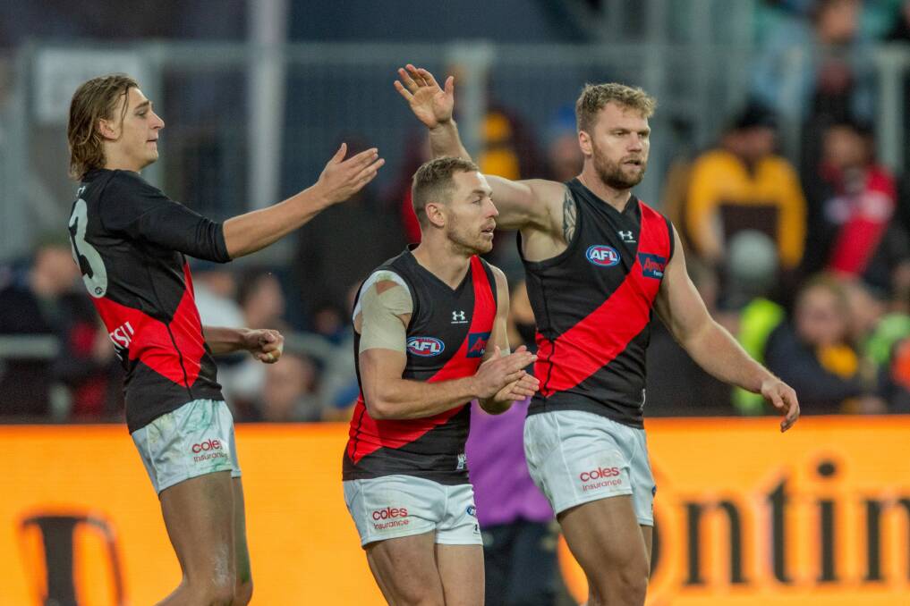 AFL VISITORS: Essendon's Harrison Jones, Devon Smith and Jake Stringer at Launceston's UTAS Stadium earlier this year, an extra match which the state has hosted this season. Picture: Phillip Biggs 