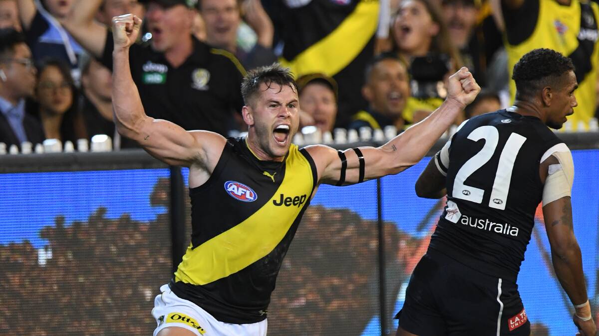 NEW TIGER: Maverick Weller celebrates his goal on Thursday night in Richmond's win over Carlton, which was his first game as a Tiger. Picture: AAP Image/Julian Smith