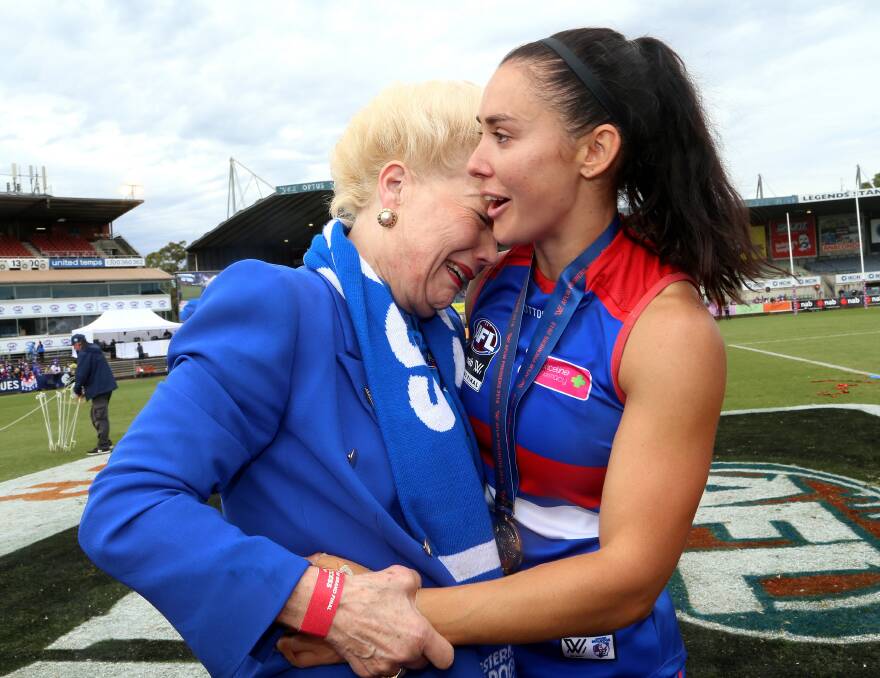 Susan Alberti and Nicole Callinan after the Western Bulldogs' 2018 premiership. Picture: AAP Image/Hamish Blair