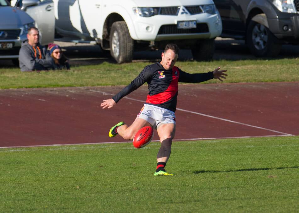 BANG: Ulverstone's Darren Banham gets the ball forward in his side's NWFL win over Latrobe on Saturday. Picture: Matt Powell
