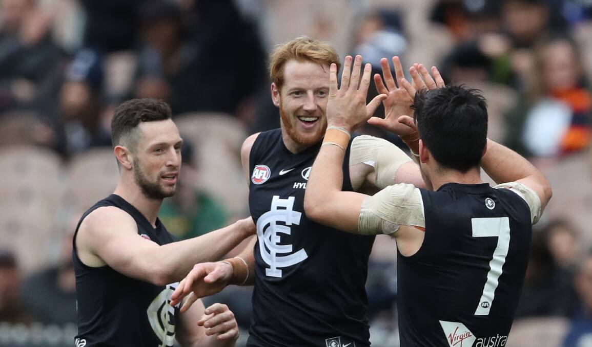 HAPPY BLUE: Andrew Phillips celebrates a goal on Saturday in Carlton's win over Adelaide. Picture: AAP Image/David Crosling 